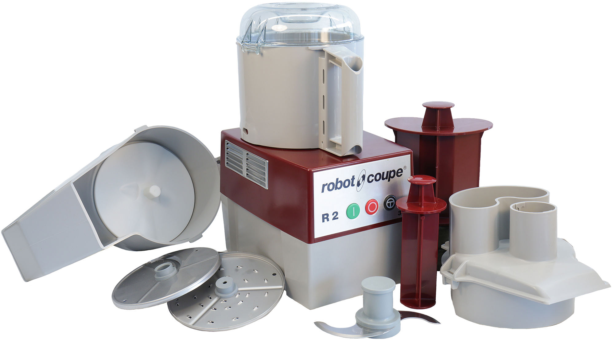 A food processor with all of its attachments, including a shoot, slicing and dicing blades, S-blade, and tampers.
