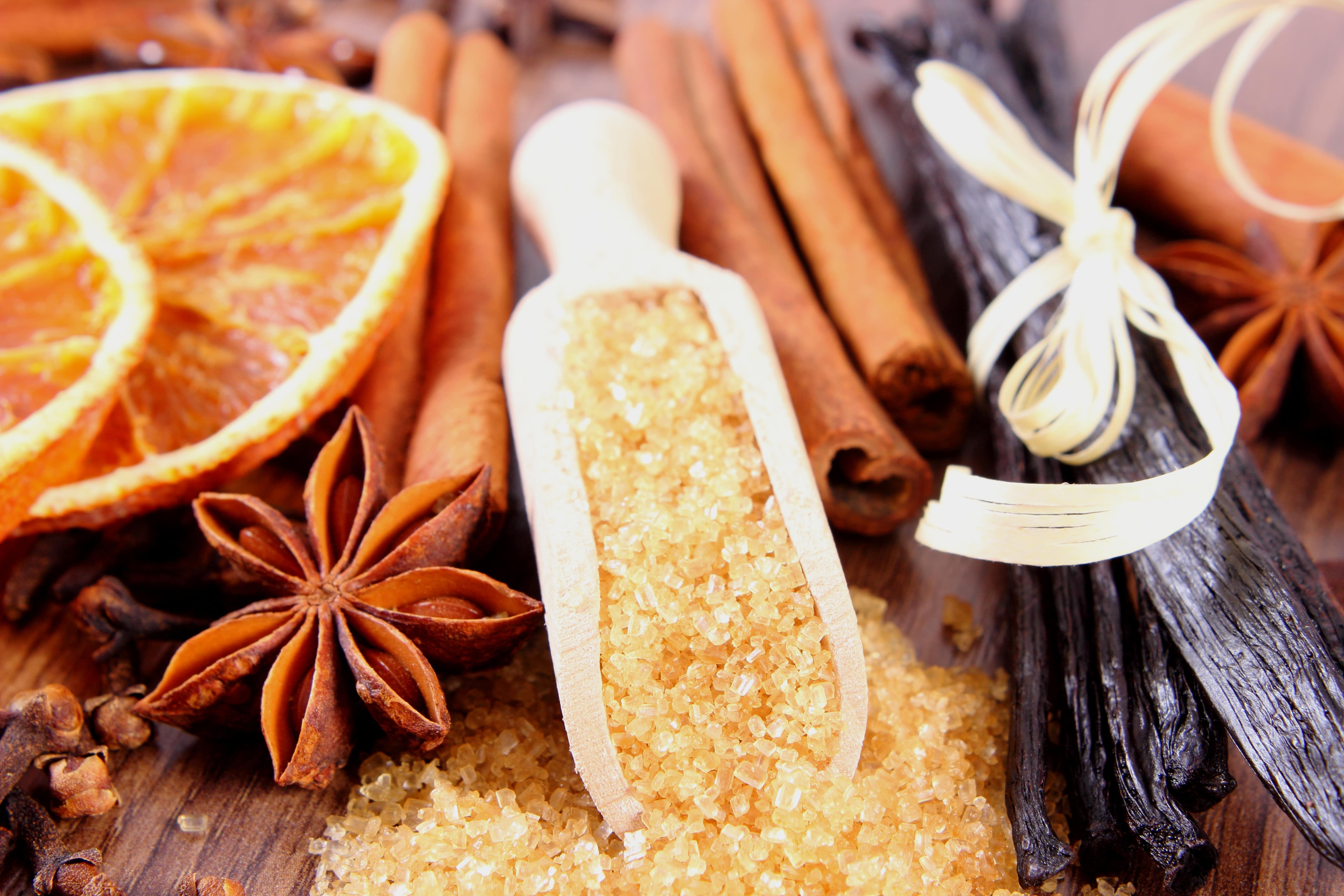 Brown sugar cane, fragrant vanilla pods and cinnamon sticks, star anise, cloves and dried orange. Seasoning for cooking or baking.