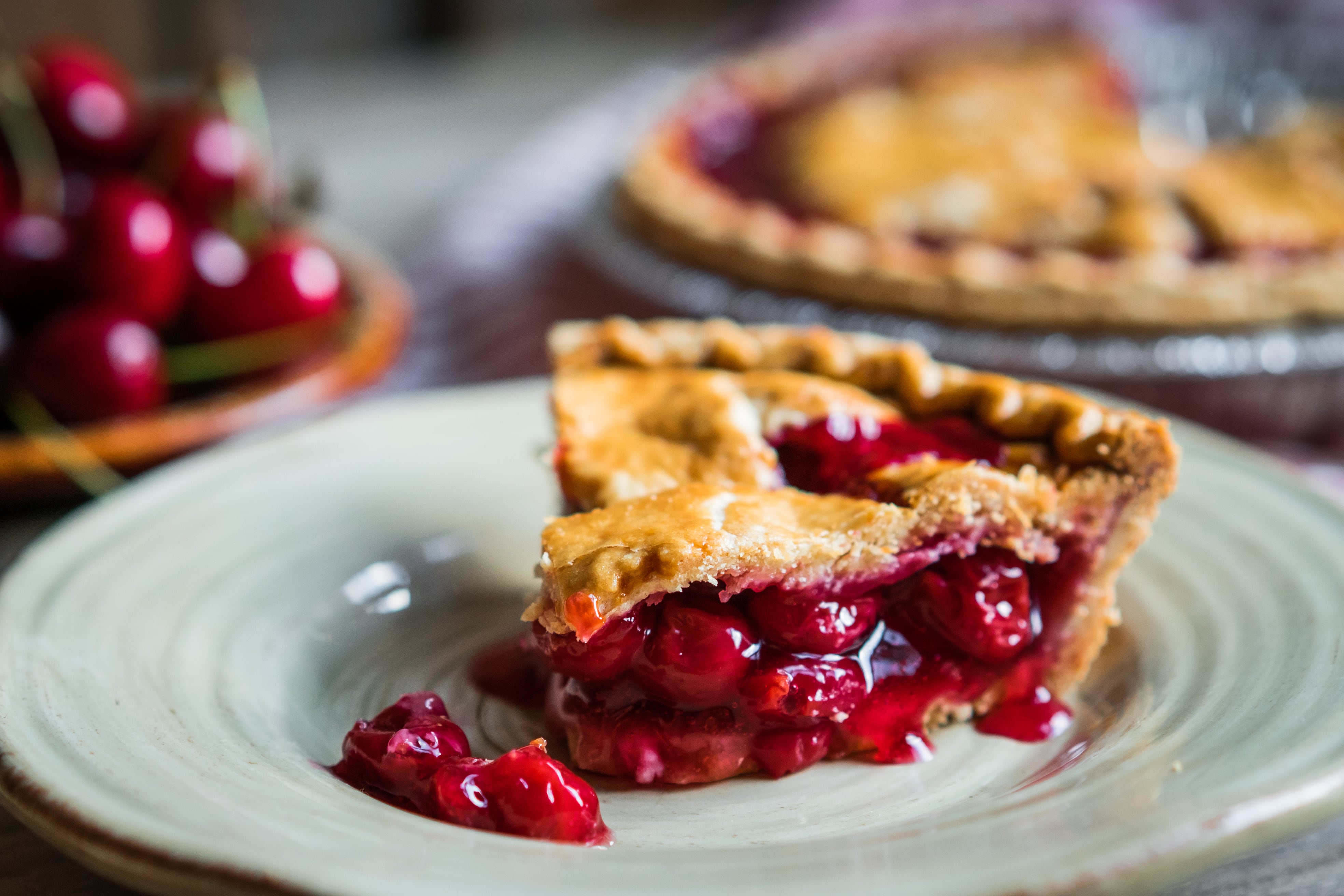 Homemade cherry pie on rustic background.