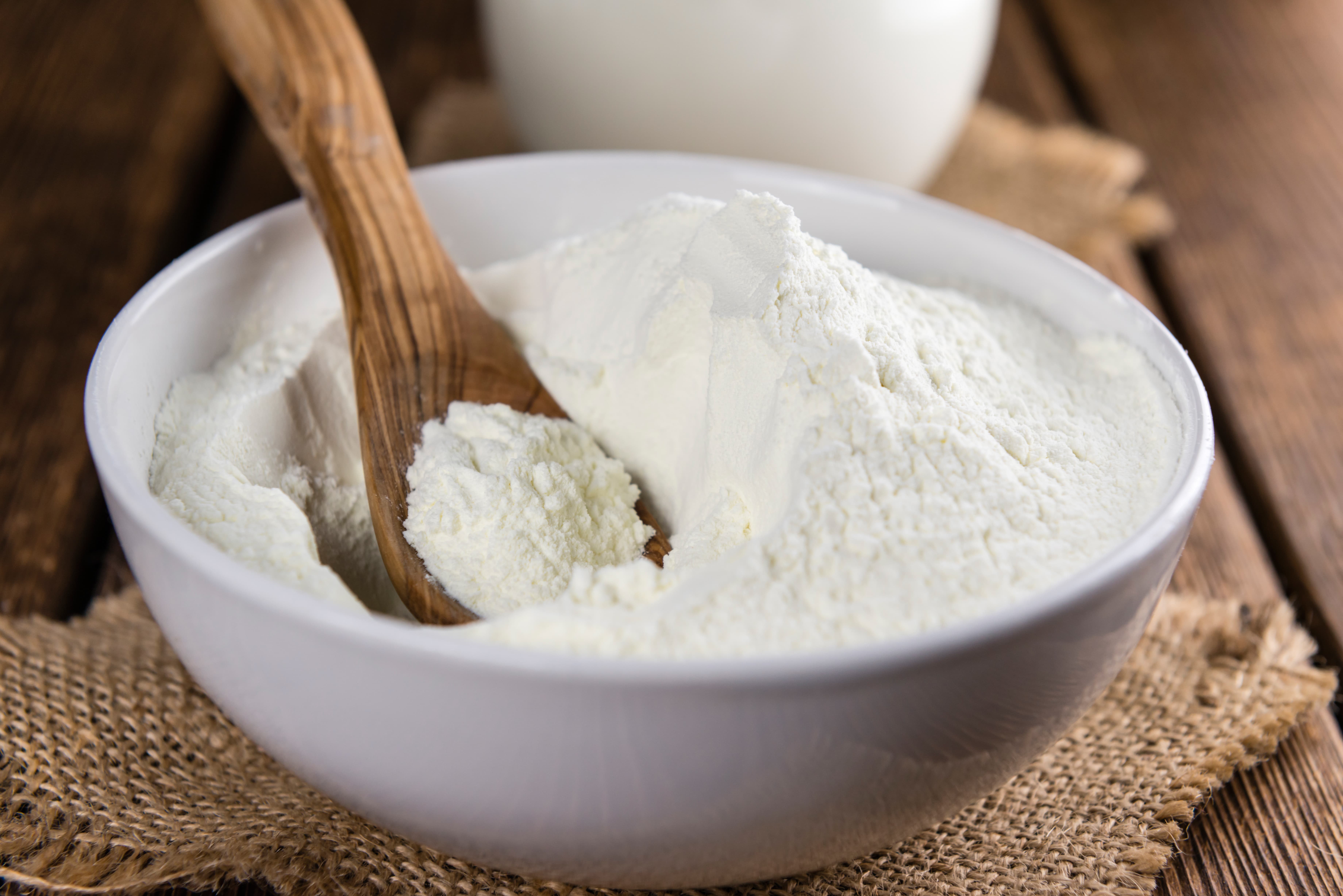 Portion of Milk Powder on an old wooden table