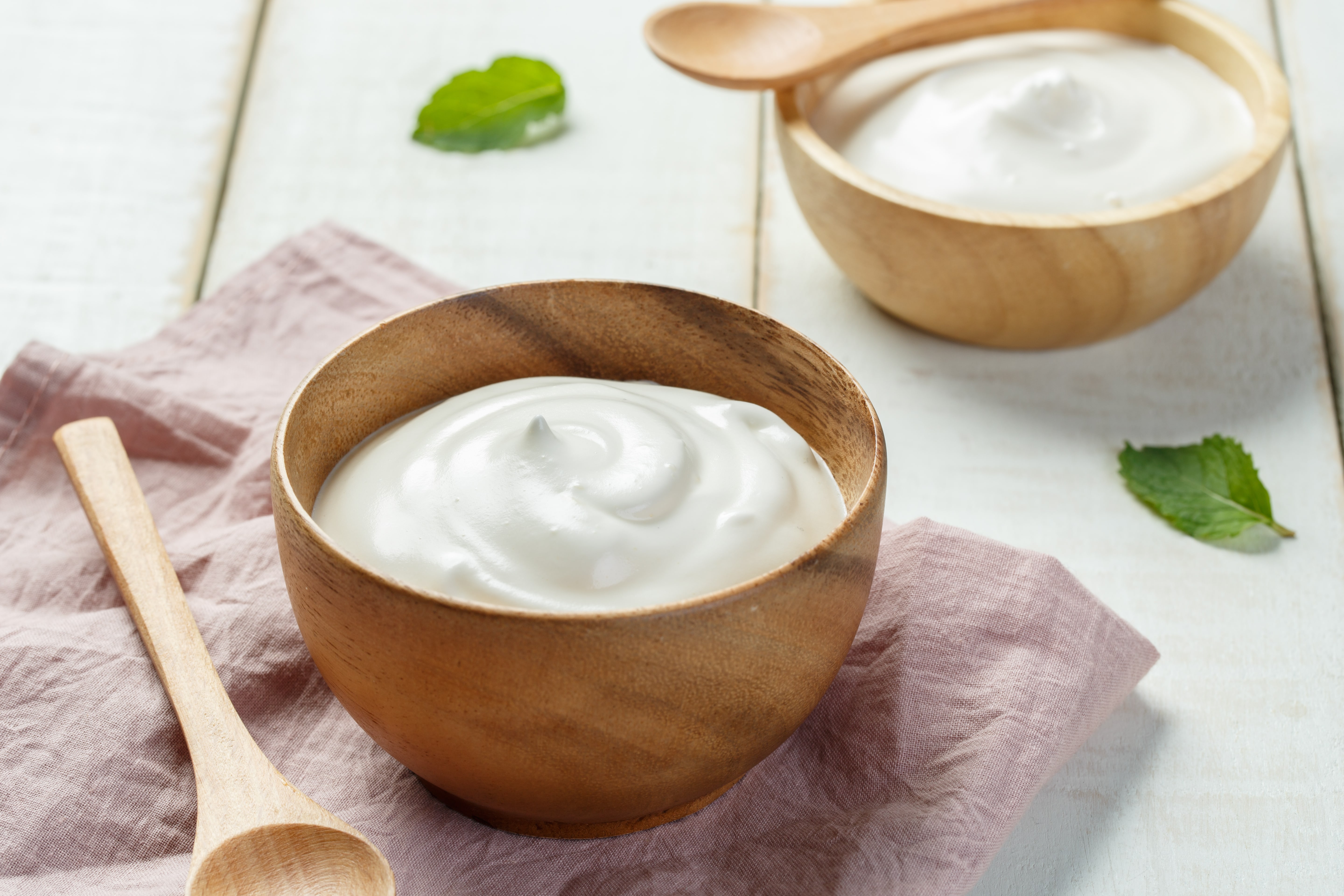 Homemade yogurt in a wooden bowl.